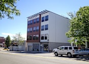Thumbnail 32 of 36 - Modern four story building exterior with parking at 68 Beale Apartments, Quincy, 02169
